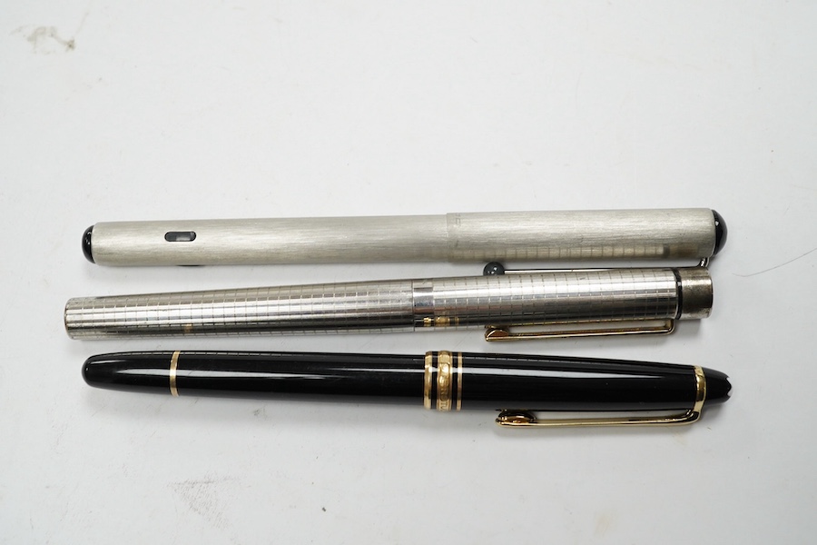 Two Montblanc fountain pens and a Sheaffer fountain pen, in a Montblanc case. Condition - fair to good